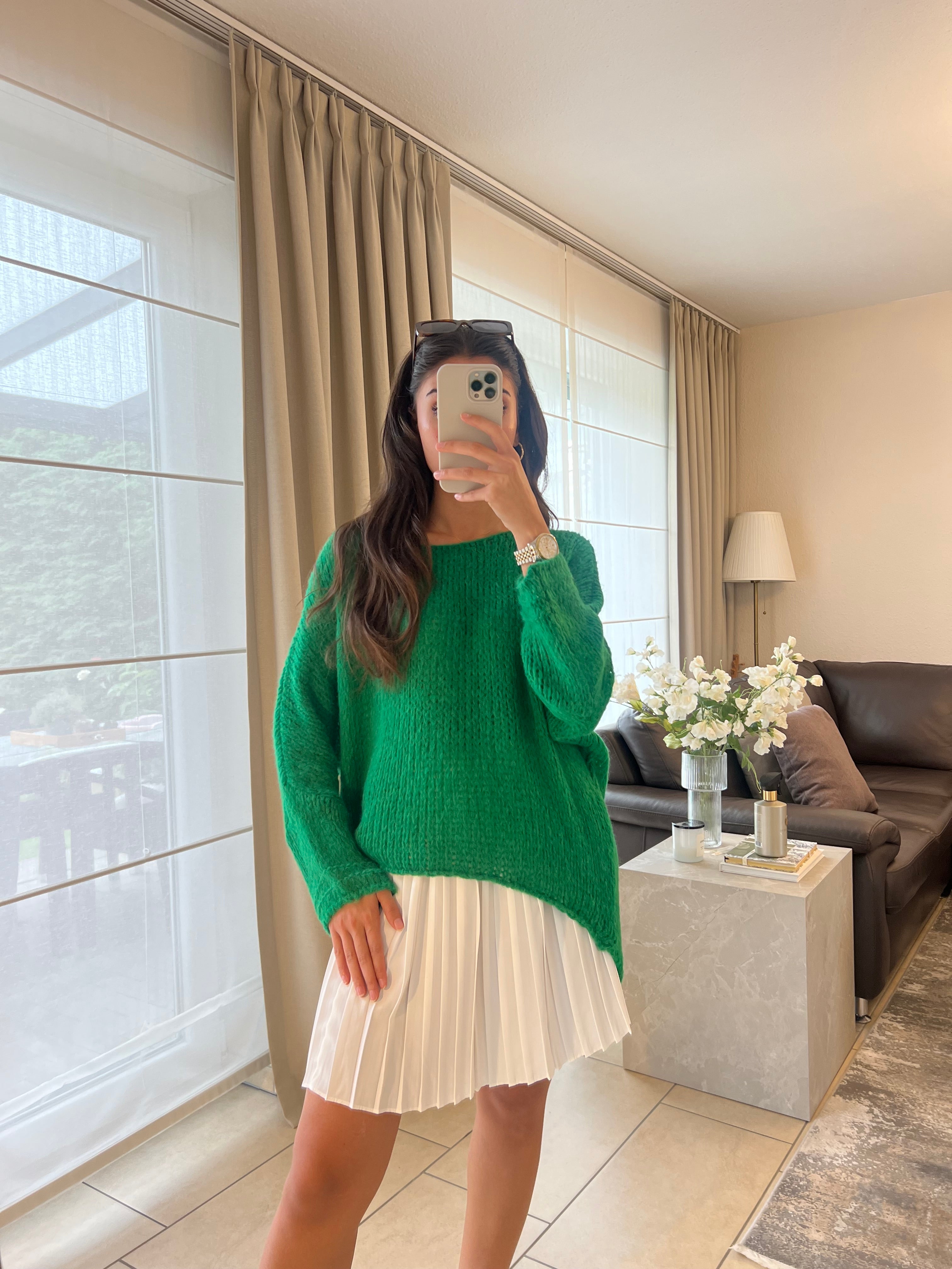 Knitting sweater asymmetrically green