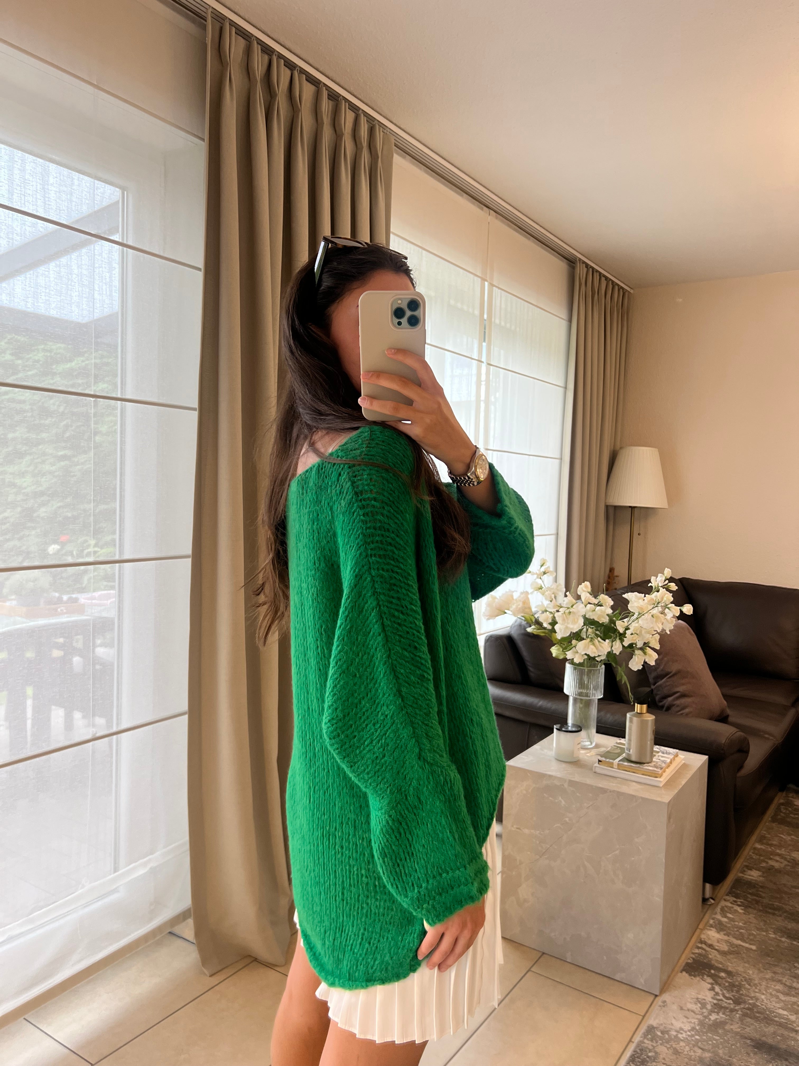 Knitting sweater asymmetrically green