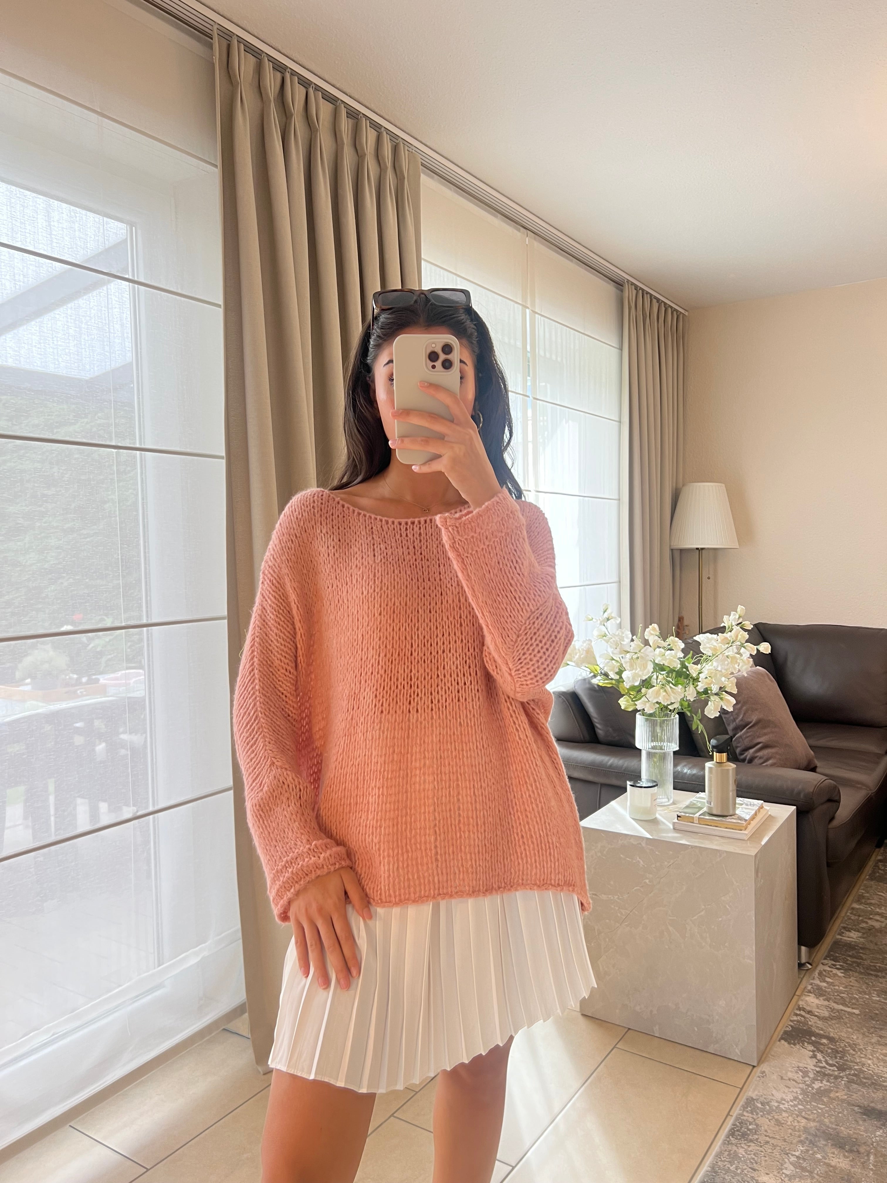 Knitting sweater asymmetrically pink